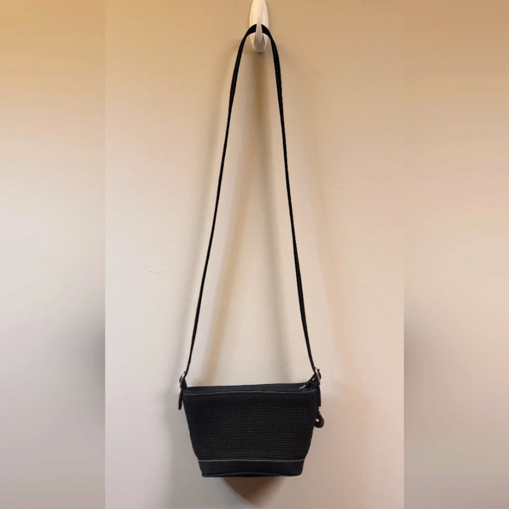 The Sak black small crochet knit crossbody purse